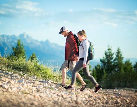 couple hiking snow king mountain