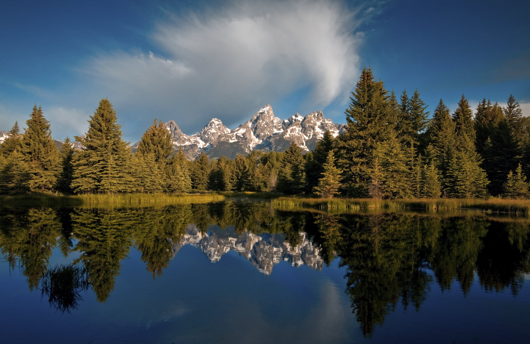 reflection of the grand teton in jackson hole